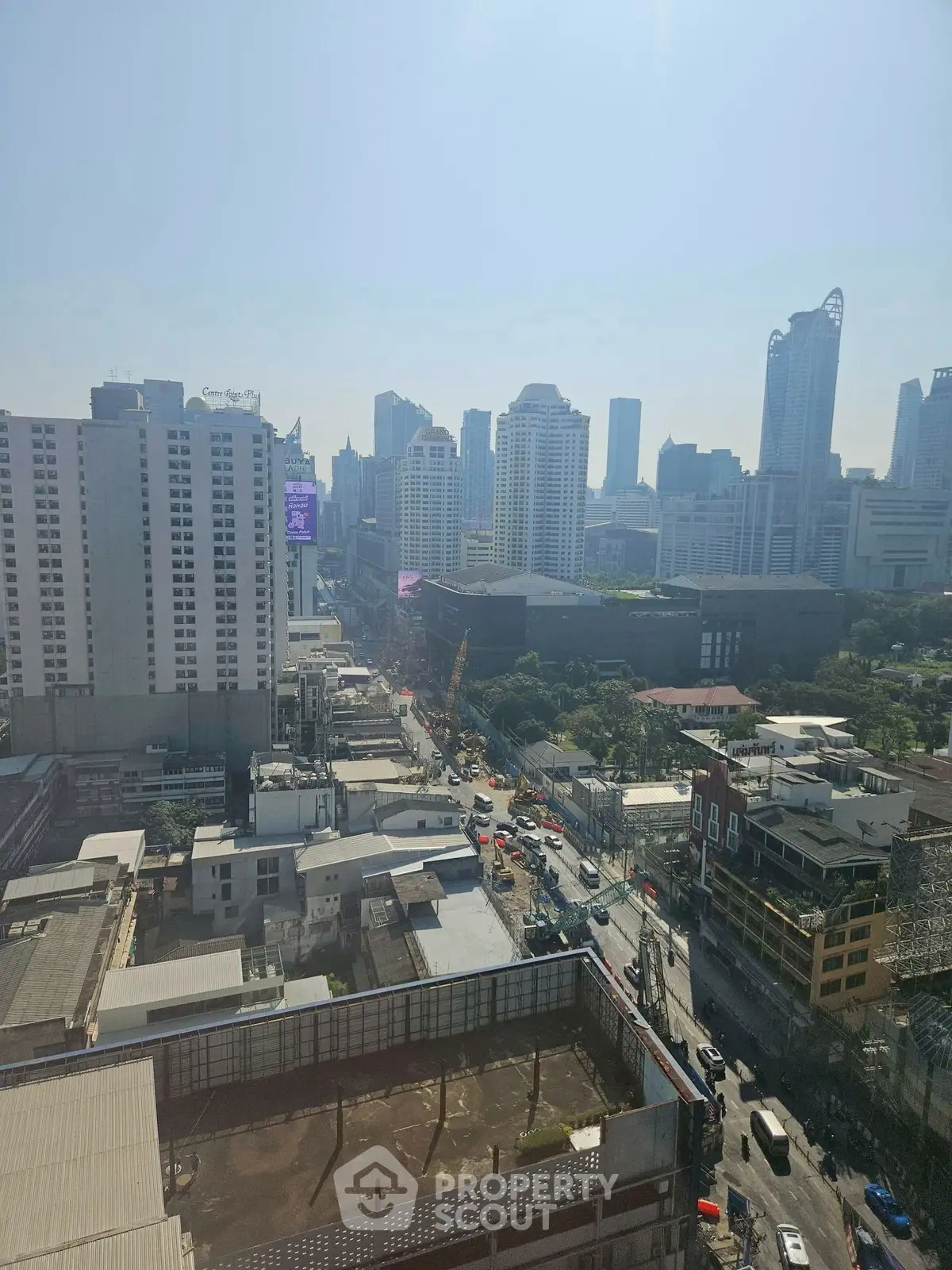 Stunning cityscape view from high-rise building showcasing urban skyline and bustling streets.