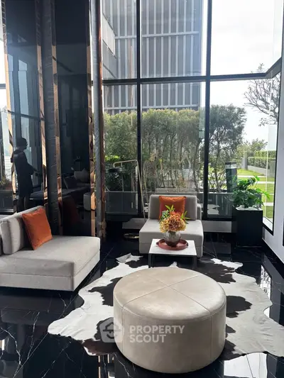 Luxurious modern living room with floor-to-ceiling windows and stylish decor.