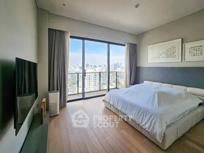 Luxurious bedroom with stunning city view and modern decor