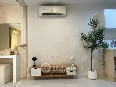 Modern living room with air conditioning and stylish furniture, perfect for comfortable living.
