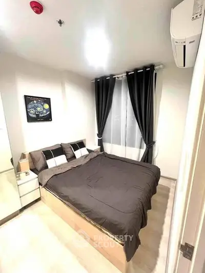 Cozy bedroom with modern decor, featuring a comfortable bed, stylish curtains, and wall art for a relaxing ambiance.