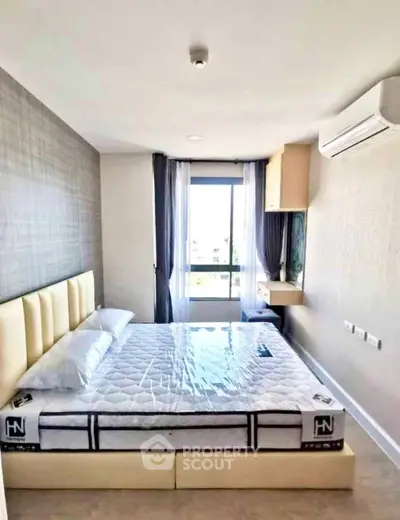 Modern bedroom with stylish decor and natural light