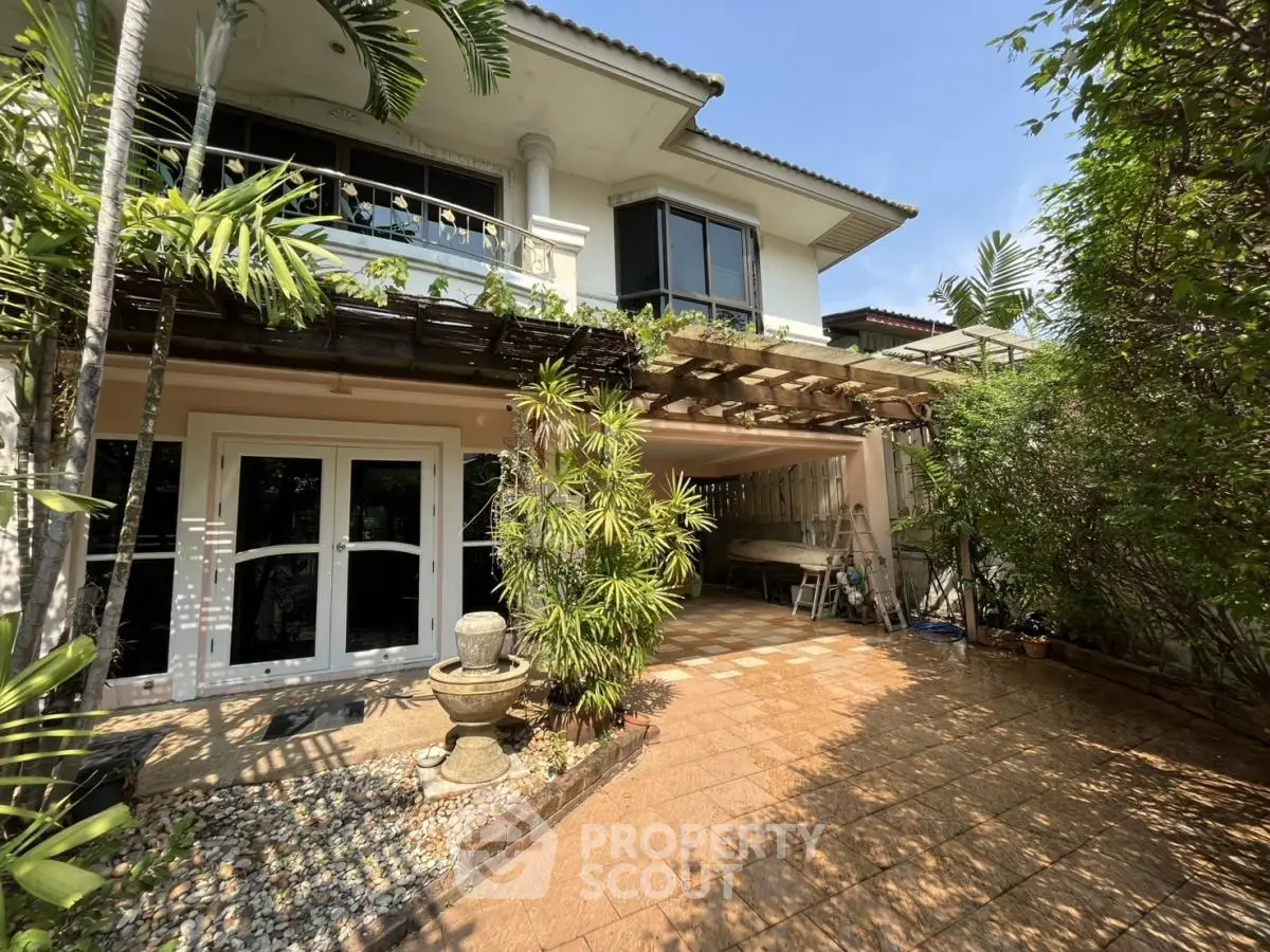 Charming two-story house with lush garden and spacious patio