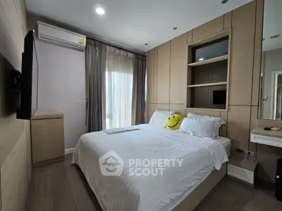 Modern bedroom with stylish wood paneling and natural light