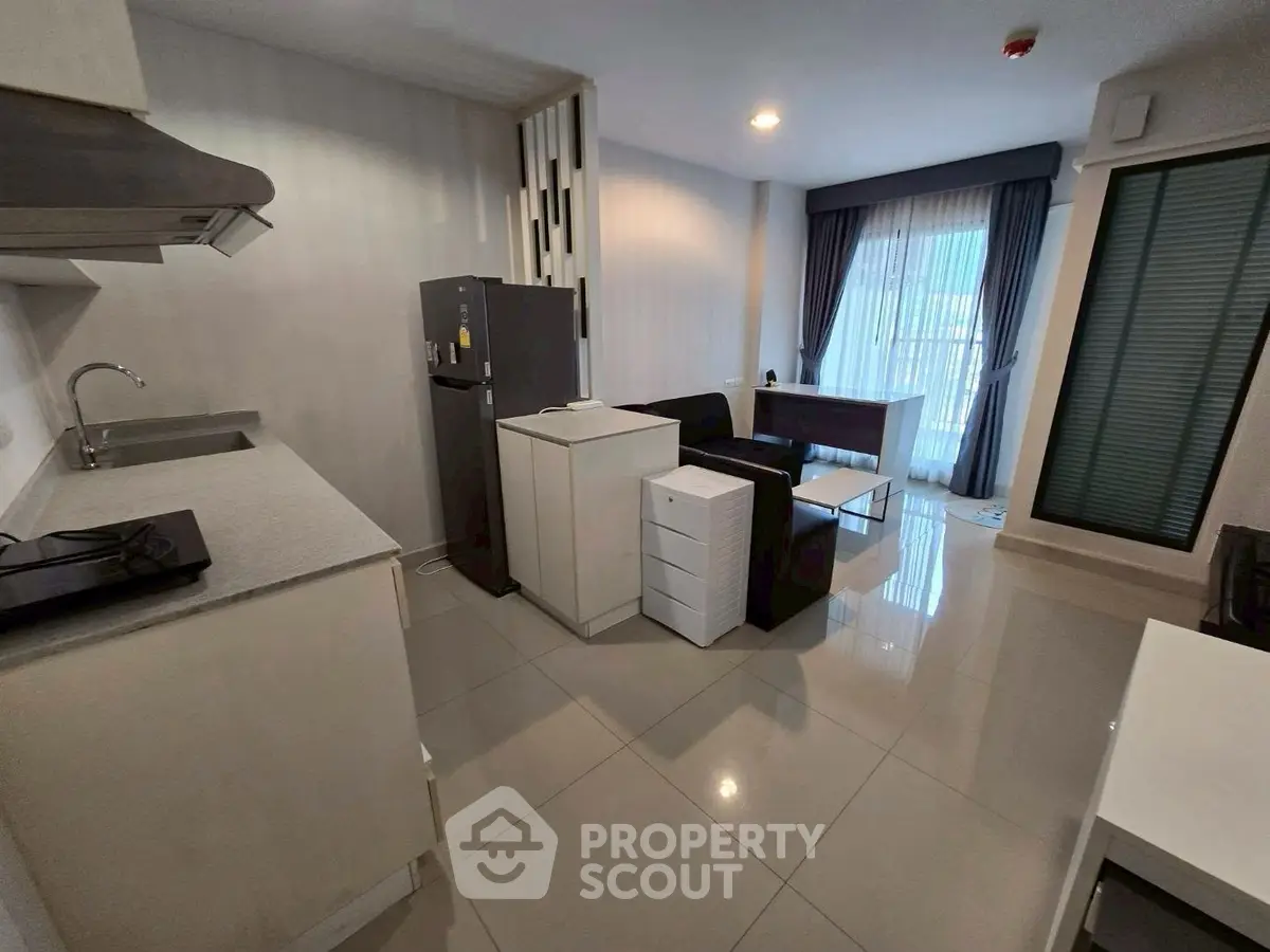 Modern open-layout kitchen and living area with sleek design