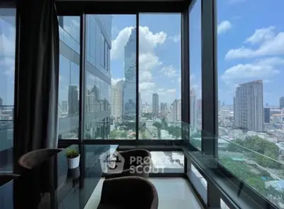 Stunning city view from modern high-rise apartment with floor-to-ceiling windows and elegant dining area.