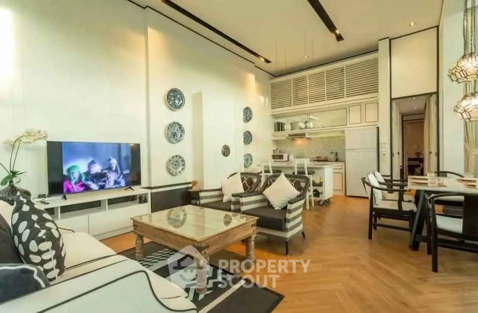 Stylish open-layout living room with modern kitchen and elegant decor