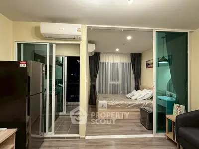 Modern apartment interior with sliding glass doors and cozy bedroom