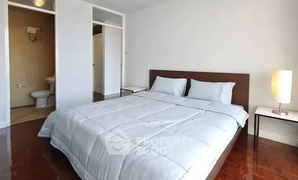 Spacious bedroom with ensuite bathroom and modern decor