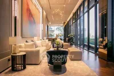 Luxurious modern living room with floor-to-ceiling windows and elegant decor