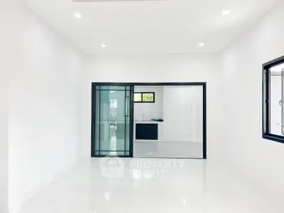 Spacious modern interior with sleek sliding glass doors and bright lighting