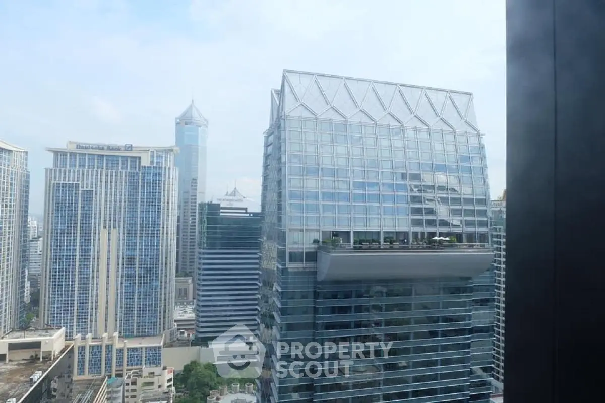 Stunning cityscape view featuring modern skyscrapers and unique architectural design.