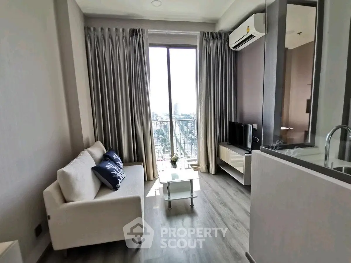 Modern living room with city view, stylish sofa, and sleek TV setup