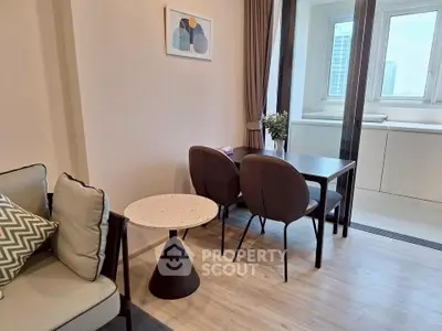 Modern living room with stylish furniture and city view, perfect for urban living.