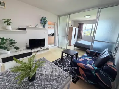 Modern open-plan living room with stylish decor and natural light