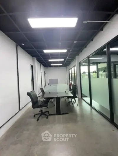 Modern office space with sleek design and glass partitions