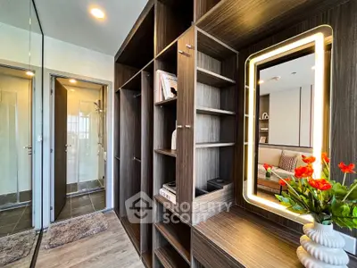 Modern apartment interior with stylish shelving and illuminated mirror