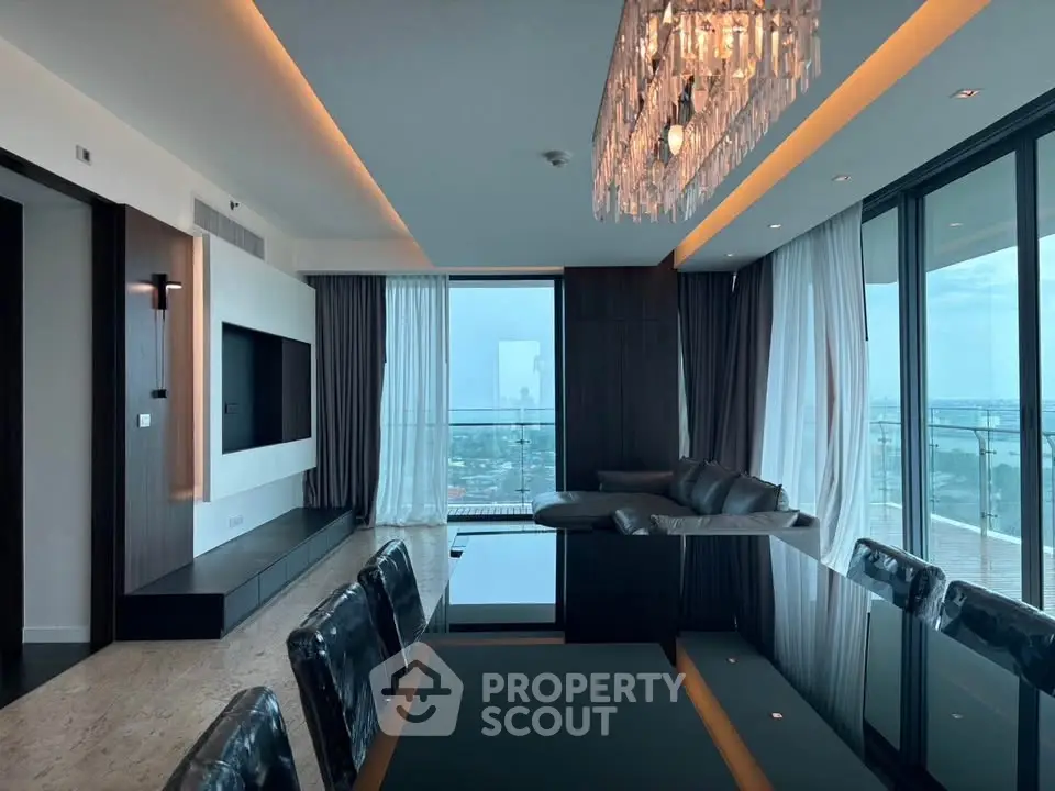 Luxurious modern living room with panoramic windows and elegant chandelier