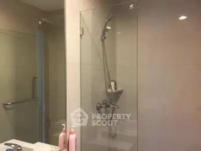 Modern bathroom with glass shower and sleek fixtures