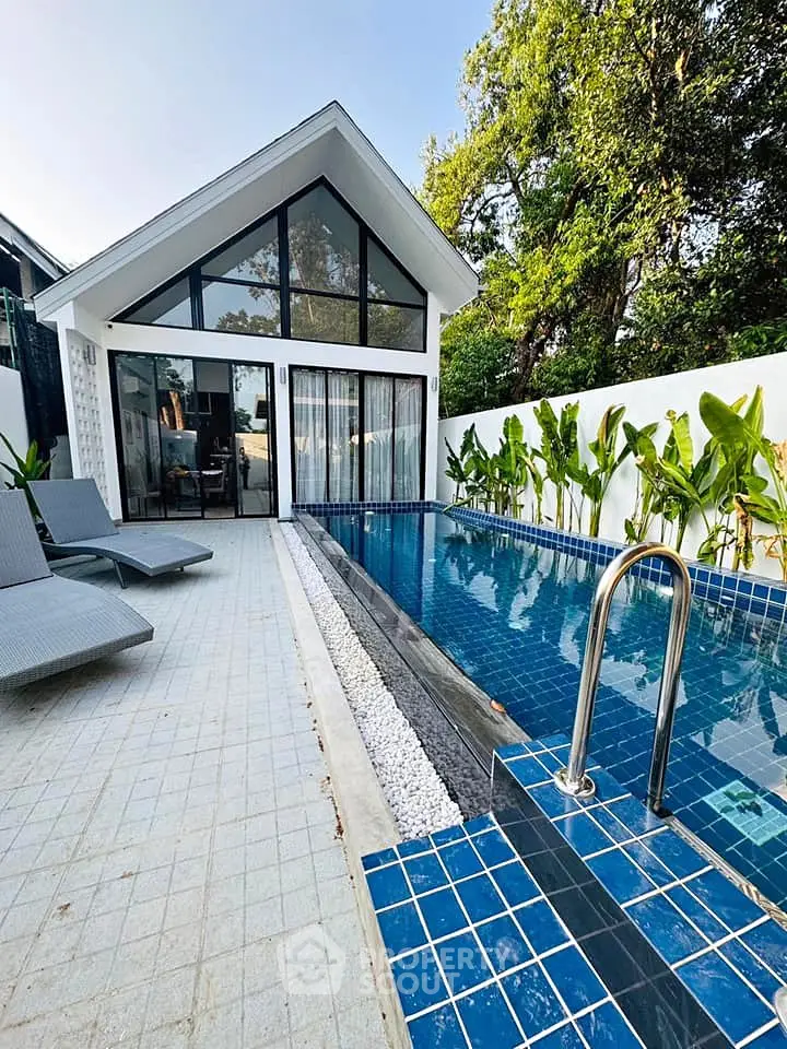 Modern villa with private pool and lush garden, perfect for luxury living.