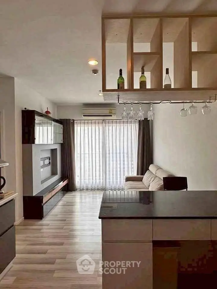 Modern living room with stylish shelving and cozy sofa, perfect for relaxation and entertainment.