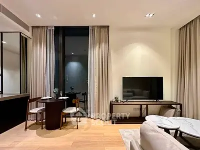 Modern living room with elegant decor, featuring a cozy dining area and sleek entertainment setup.