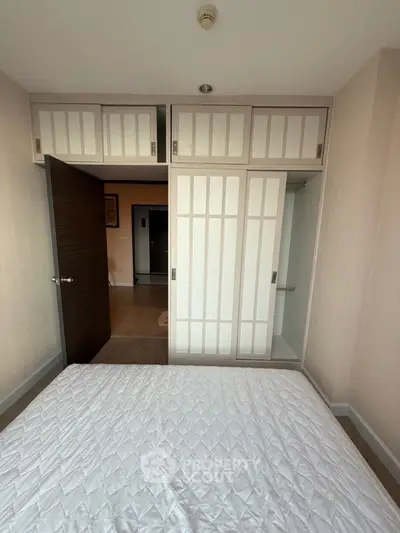 Spacious bedroom with built-in wardrobe and modern design