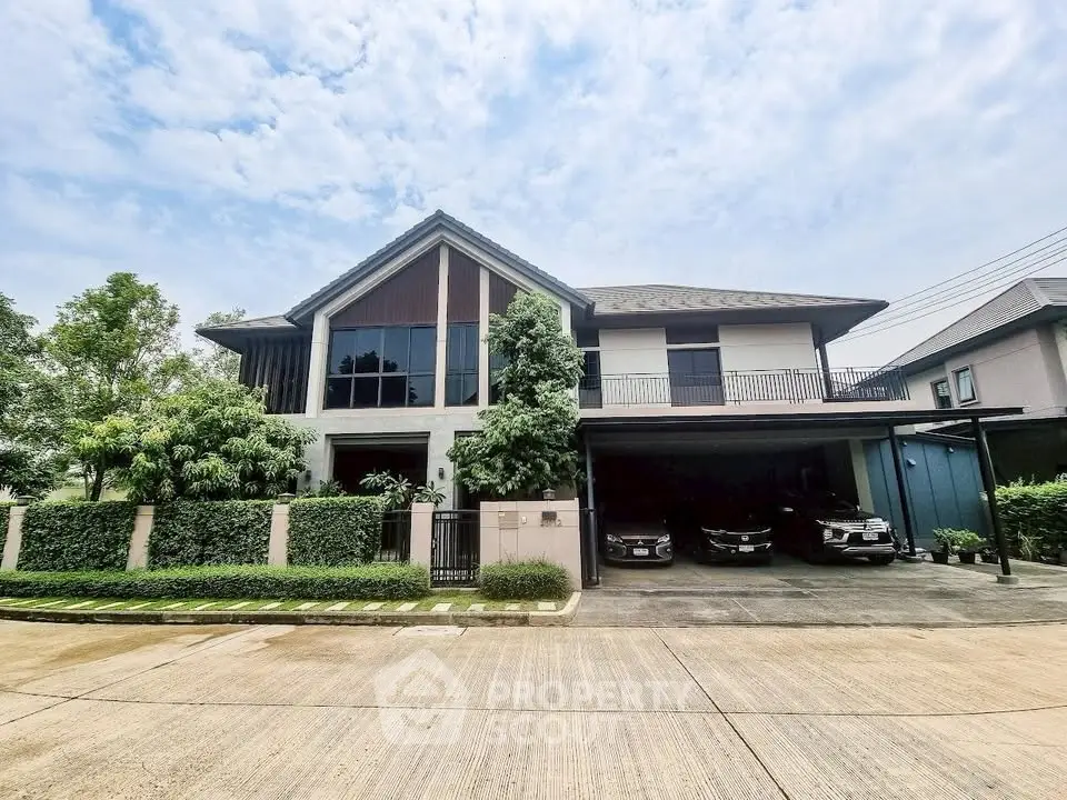 Stunning modern house with spacious driveway and lush greenery in a serene neighborhood.