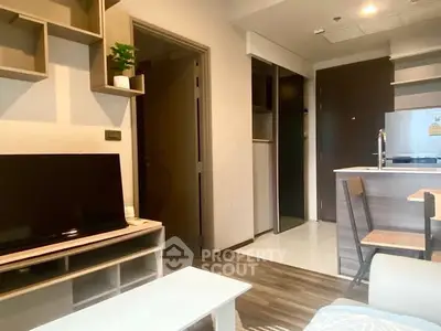 Modern living room with open kitchen and stylish decor