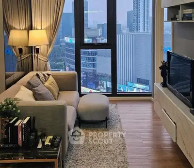 Modern living room with city view, cozy seating, and stylish decor.