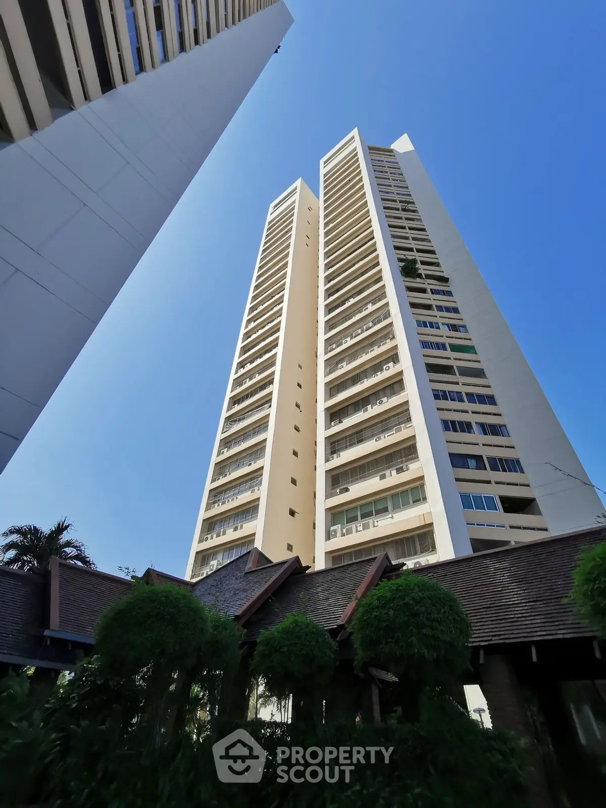 Stunning high-rise building with modern architecture against a clear blue sky.