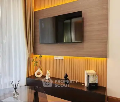 Modern living room with stylish TV setup and elegant decor
