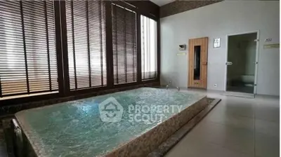 Luxurious spa room with jacuzzi and sauna in modern real estate property