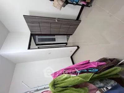 Spacious storage room with modern wardrobe and tiled flooring