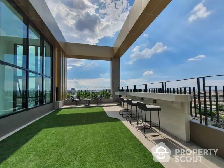 Stunning rooftop terrace with panoramic city views and modern seating area.