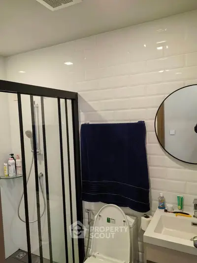 Modern bathroom with sleek shower enclosure and stylish fixtures