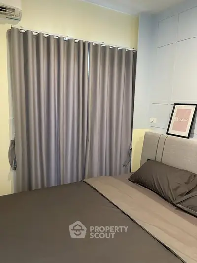 Cozy bedroom with elegant gray curtains and modern decor