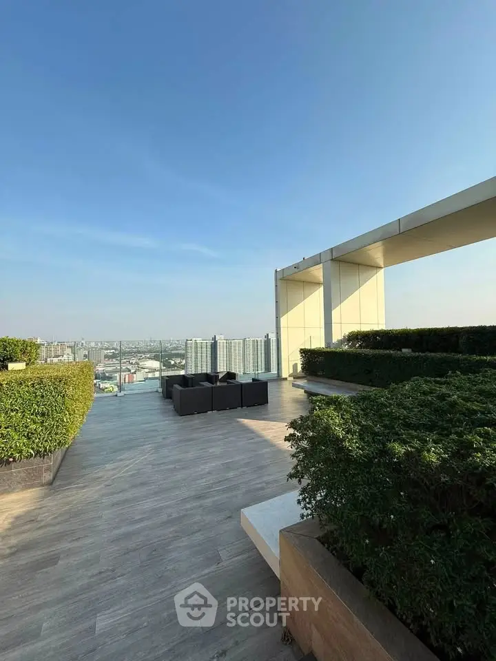 Luxurious rooftop terrace with stunning city views and modern outdoor seating.