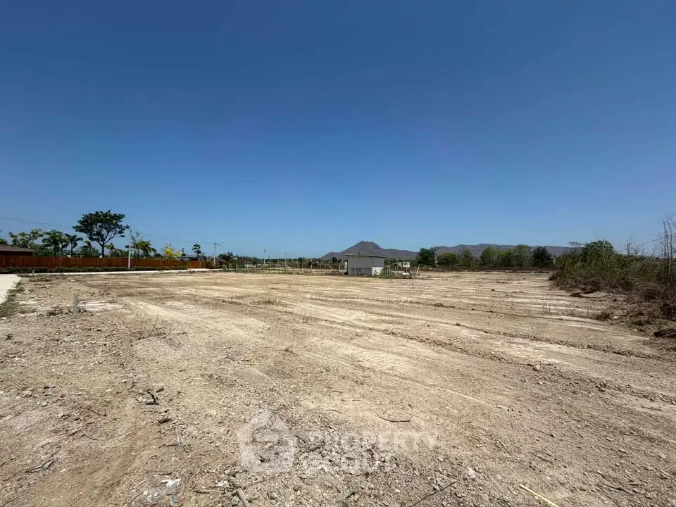 Expansive vacant land with mountain views, perfect for development opportunities.