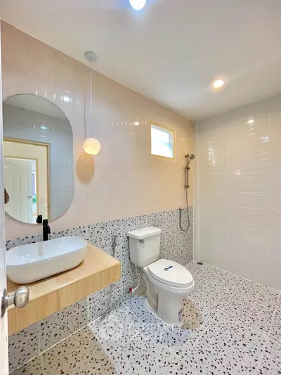 Modern bathroom with terrazzo flooring and stylish fixtures