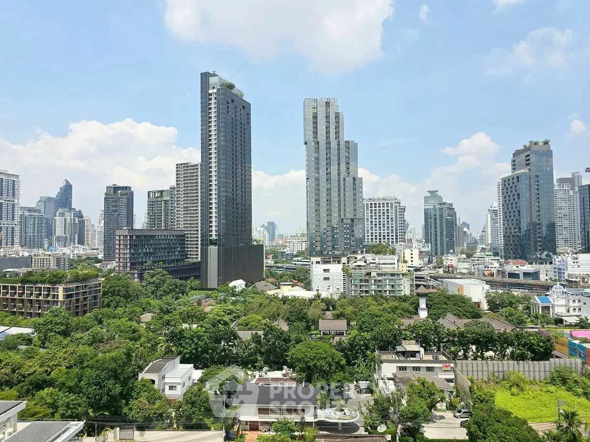 Stunning cityscape view with modern high-rise buildings and lush greenery, perfect for urban living.