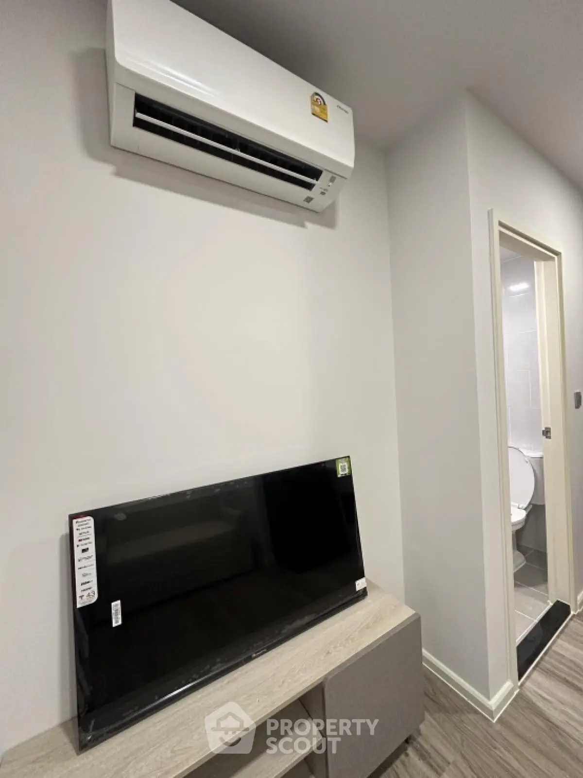 Modern apartment interior with air conditioning and TV setup