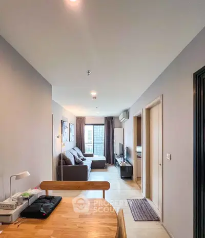Modern apartment interior with cozy living room and city view