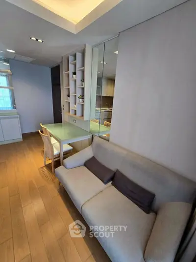 Modern living room with cozy sofa and elegant dining area