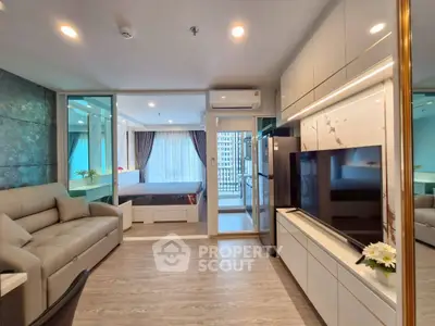 Modern open-plan living room with sleek design and natural light