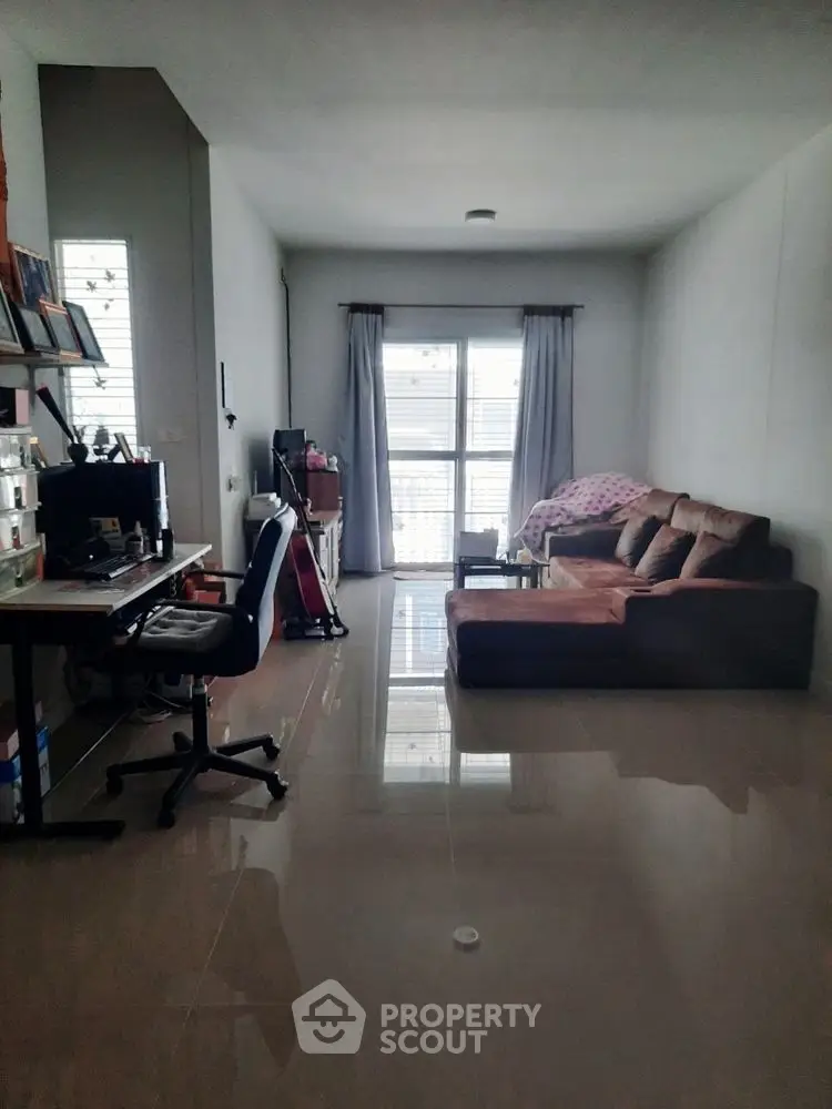 Spacious living room with modern decor and natural light