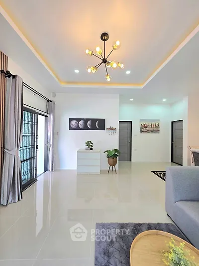 Spacious modern living room with elegant lighting and stylish decor