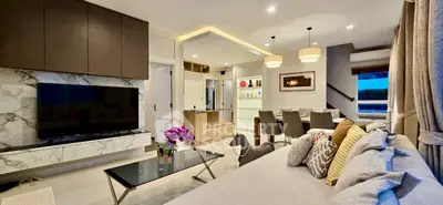 Luxurious modern living room with elegant decor and open dining area