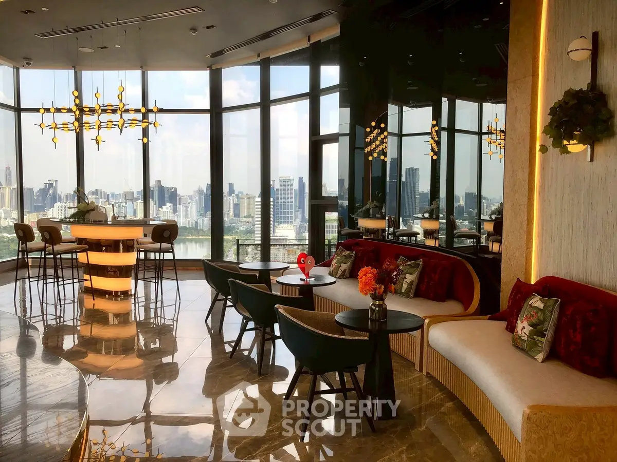 Luxurious high-rise living room with panoramic city views and elegant decor.
