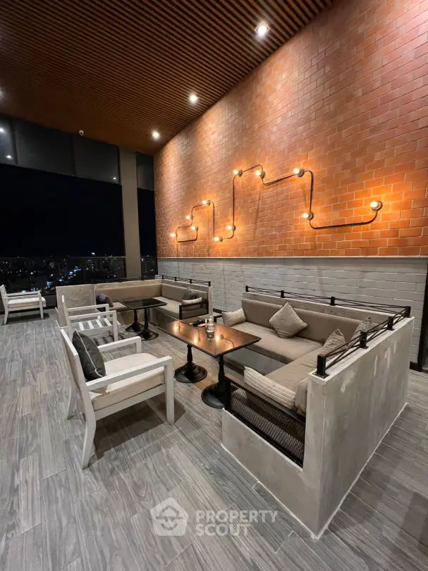 Stylish rooftop lounge with modern seating and city view